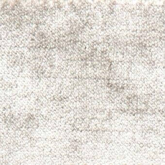 Textile sample i58, pale off-white fabric with uniform rounded particles, consistent granular texture, neutral light gray background.